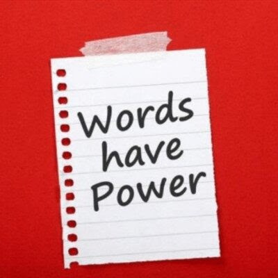 notebook paper with "words have power" written on it
